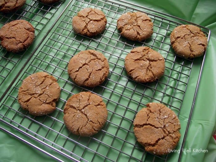 green tablecloth with cooling rack filled with gingersnap cookies