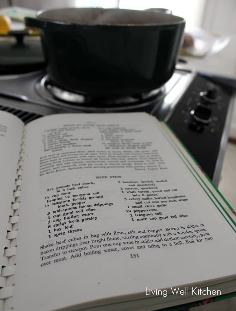 cookbook with beef stew recipe and pot of soup
