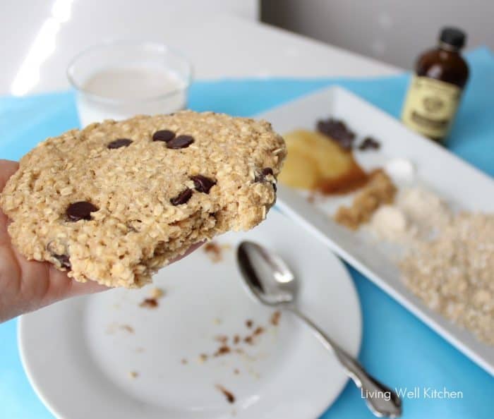 inside an oatmeal cookie with plate under and a silver spoon