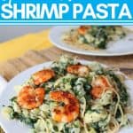 shrimp on top of pasta covered in spinach artichoke sauce