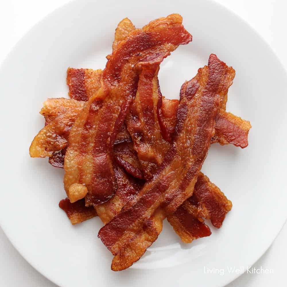 stacked Oven Baked Bacon on white plate