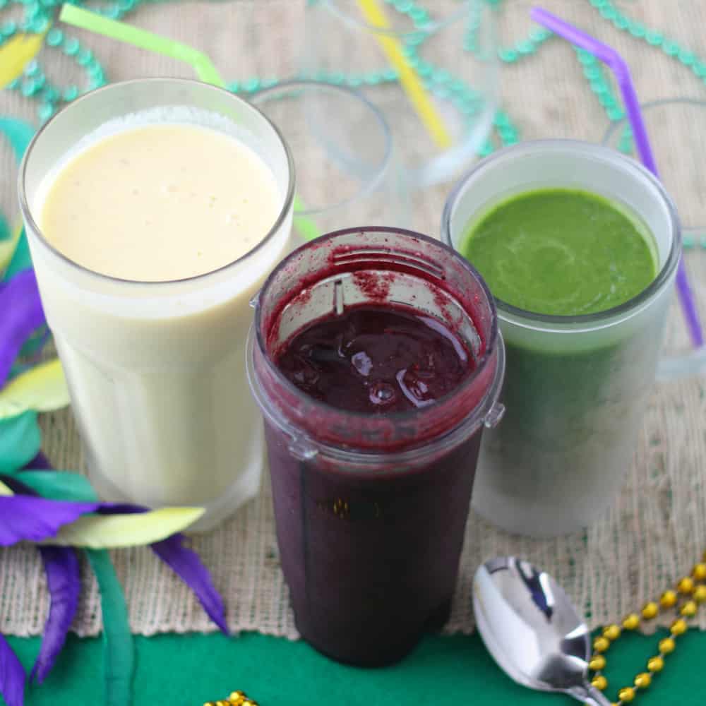 Festive, boozy Mardi Gras Smoothies from Living Well Kitchen are a great on-the-go option for getting in your fruits & veggies while watching the parades roll by