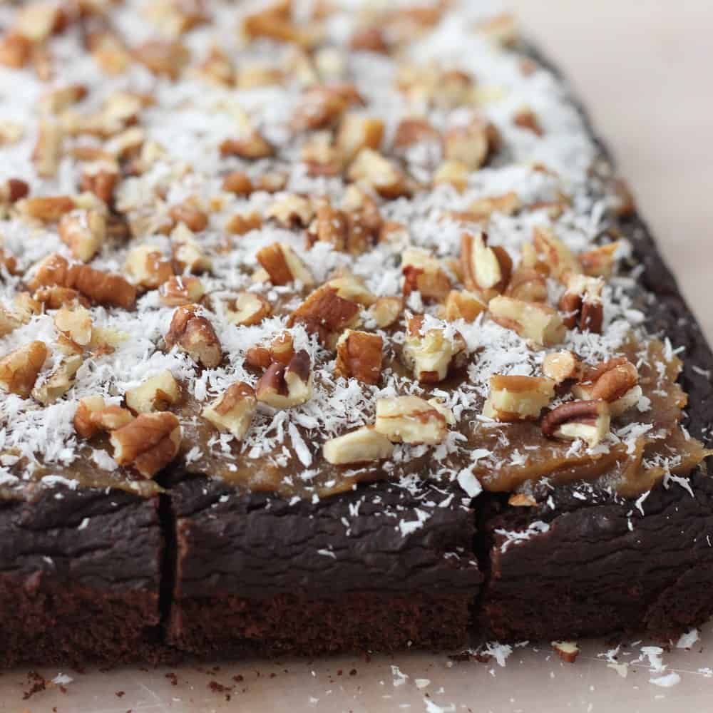 German Chocolate Brownies are black bean brownies sweetened entirely with dates topped with caramel, coconut, and pecans. Heaven!