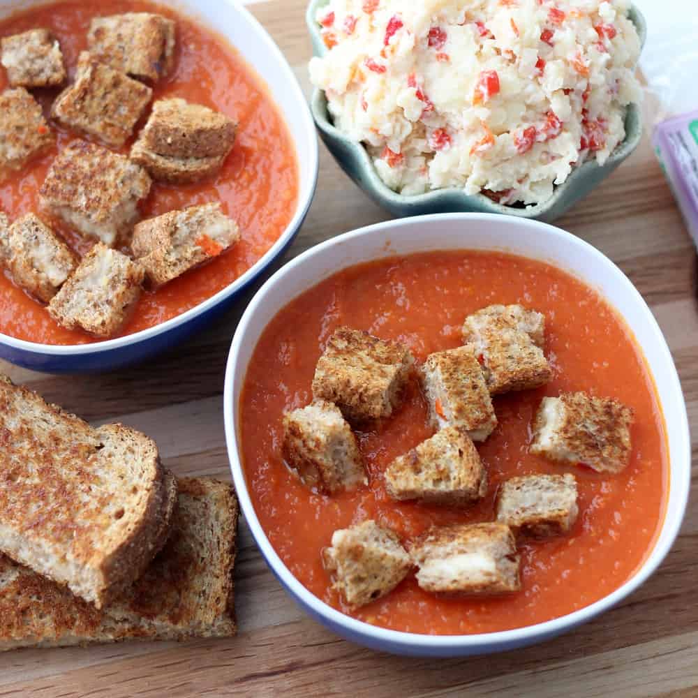 two bowls of Easy Tomato Soup with Pimento Cheese Grilled Cheese Croutons