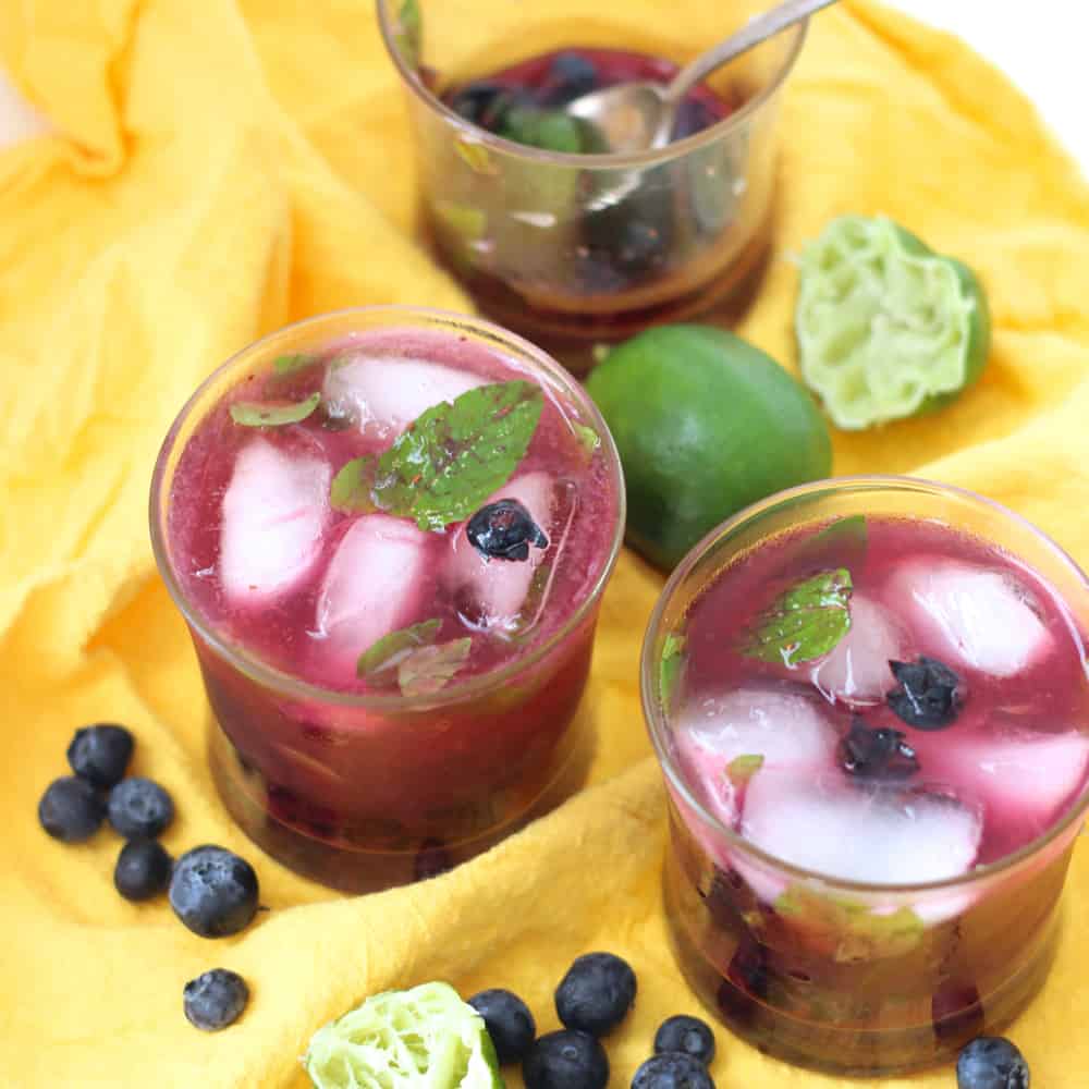 Juicy blueberries, muddled mint, fresh squeezed lime juice, an optional dash of sugar, club soda, and rum make this fabulous warm weather drink. An easy recipe for one or you can multiply to make more