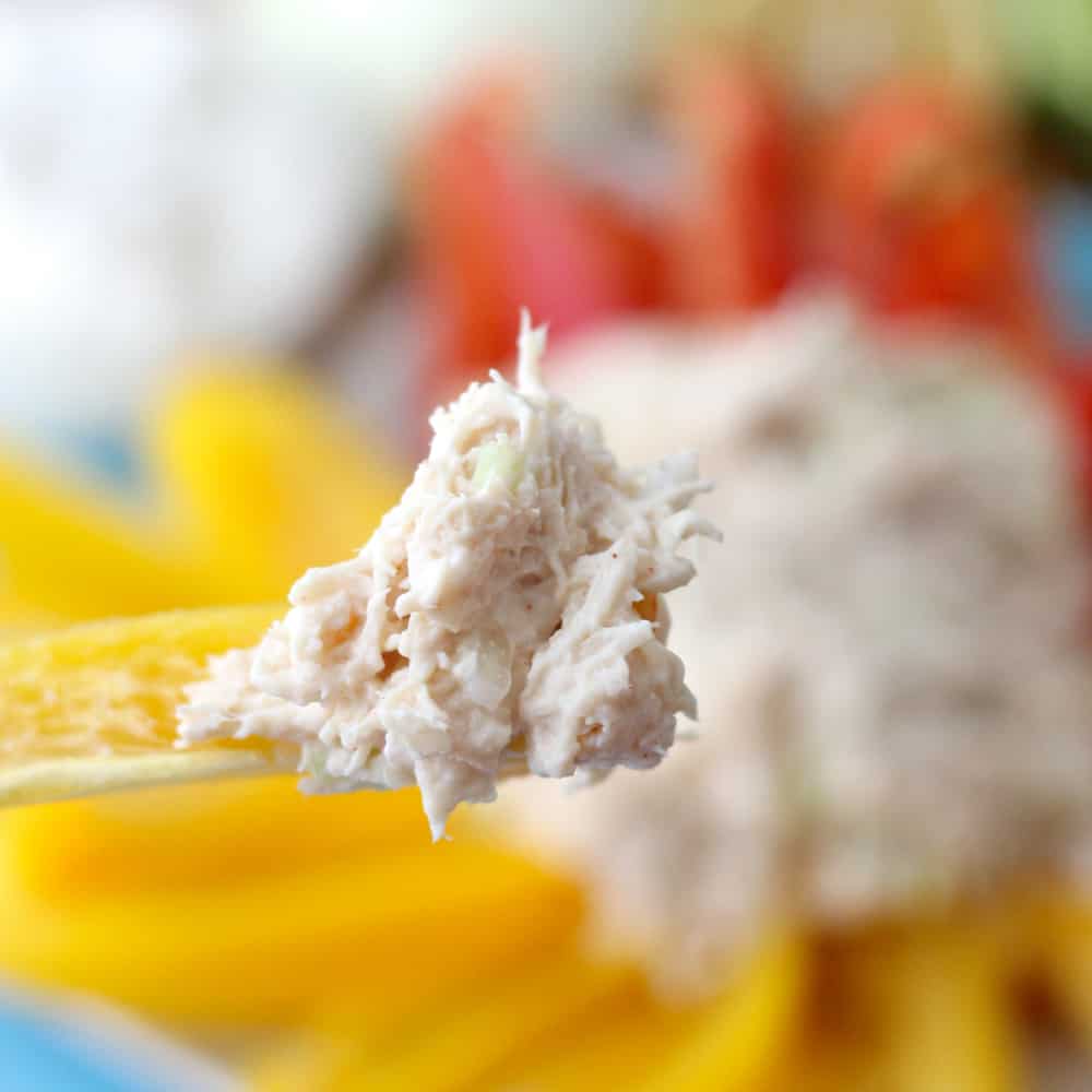 yellow bell pepper with chicken salad, with bell peppers and chicken salad in background