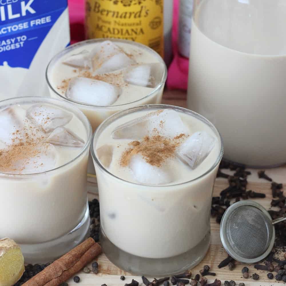 tea, spices, three glasses of Iced Chai Latte sprinkled with cinnamon