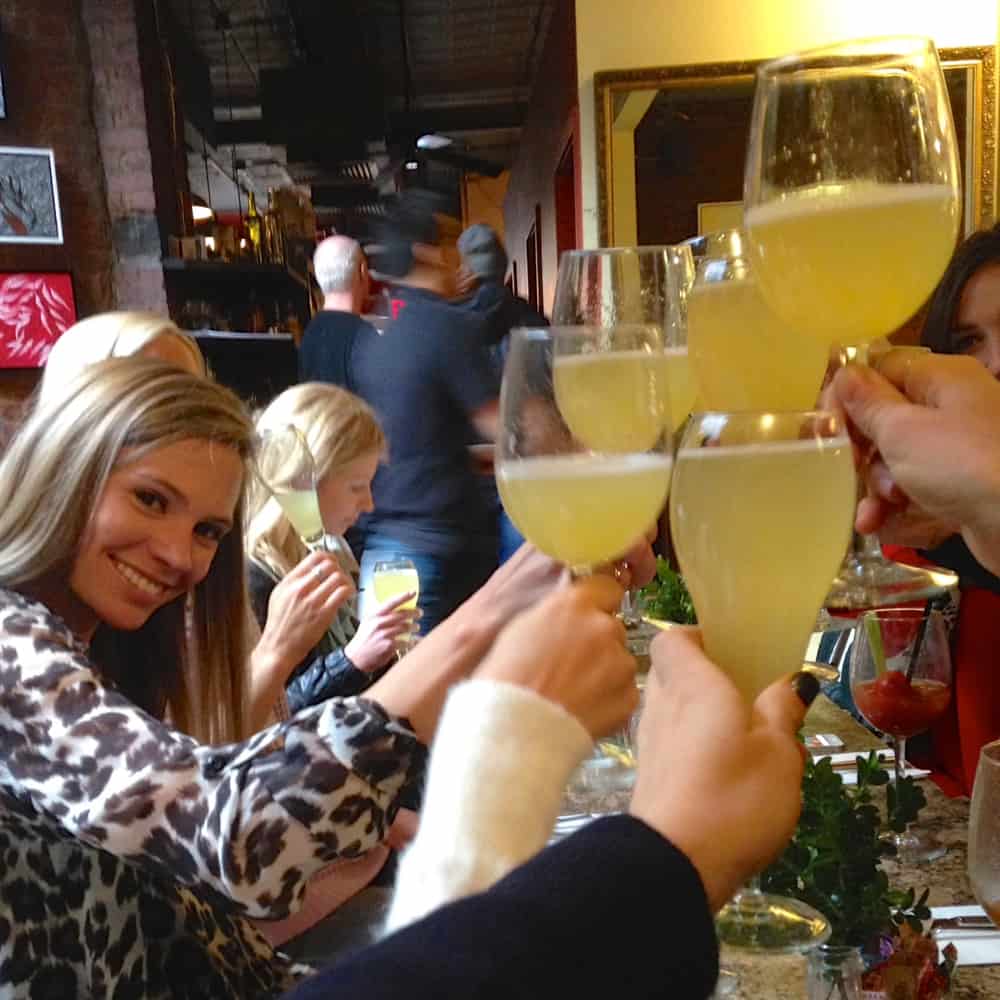 mimosas clinking glasses at Brunch at the Cupping Room Cafe
