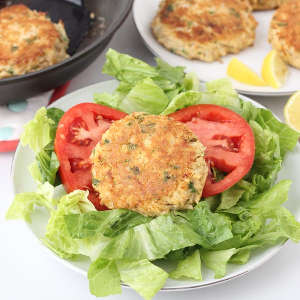 Gluten free Crab Cakes over lettuce with tomatoes