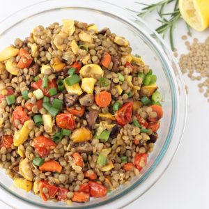 bowl of roasted vegetable lentil salad with fresh rosemary and lentils