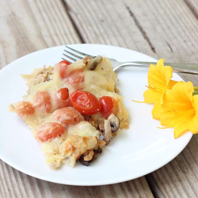 Veggie and Swiss Breakfast Casserole with tomatoes and a flower