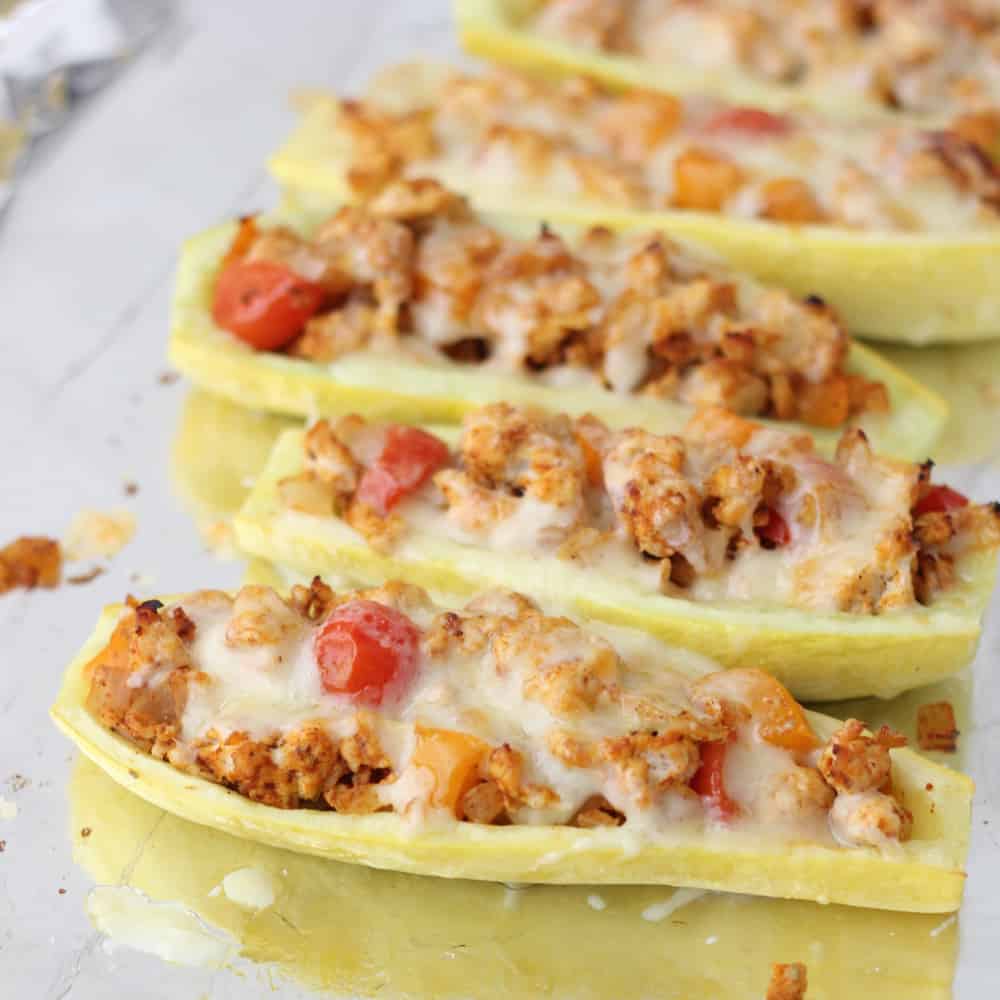 Mexican Stuffed Squash is a great, protein-filled way to use your summer produce from Living Well Kitchen @memeinge