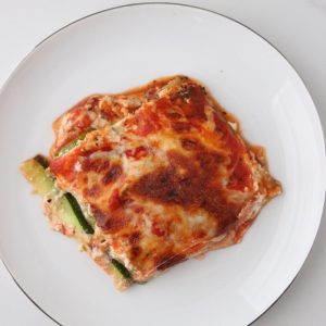 white plate with a slice of zucchini lasagna