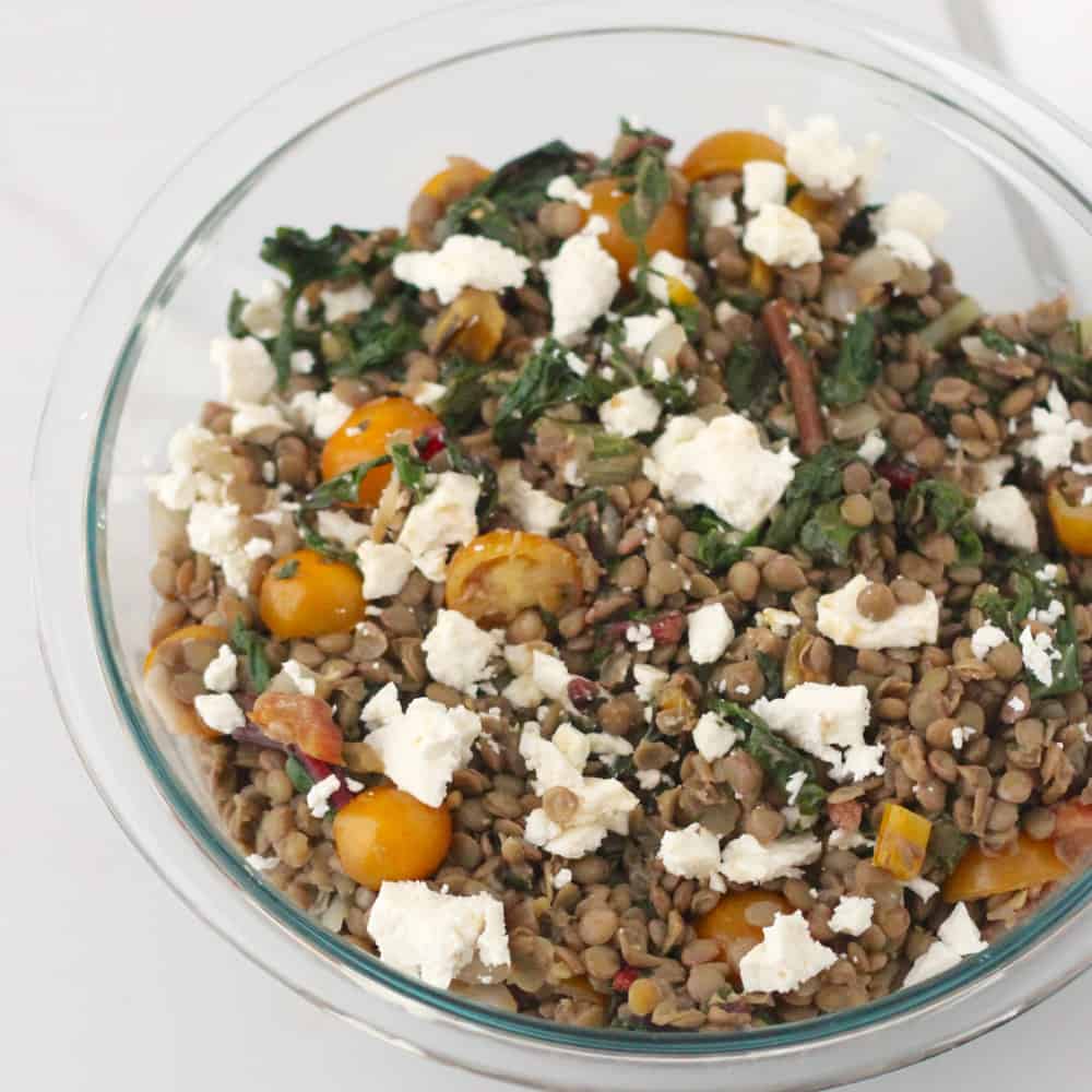 Chard and Feta Lentil Salad has a sweet and spicy dressing complements this giant lentil salad full of late summer veggies - Living Well Kitchen @memeinge