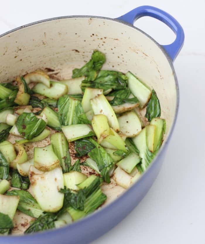 blue dutch oven with Five Spice Bok Choy