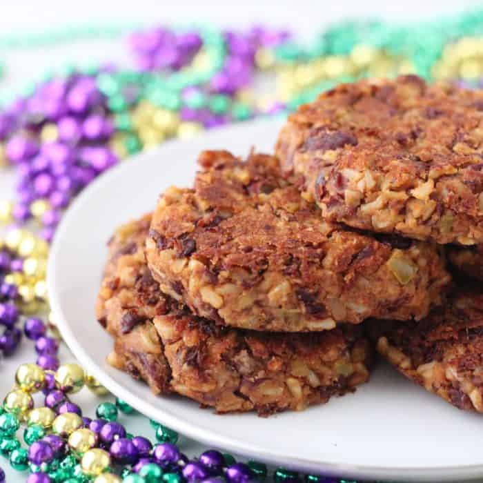 Red Beans and Rice Burger on white plate with Mardi gras beads