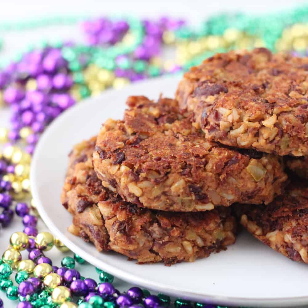 Red Beans and Rice Burger on white plate with Mardi gras beads
