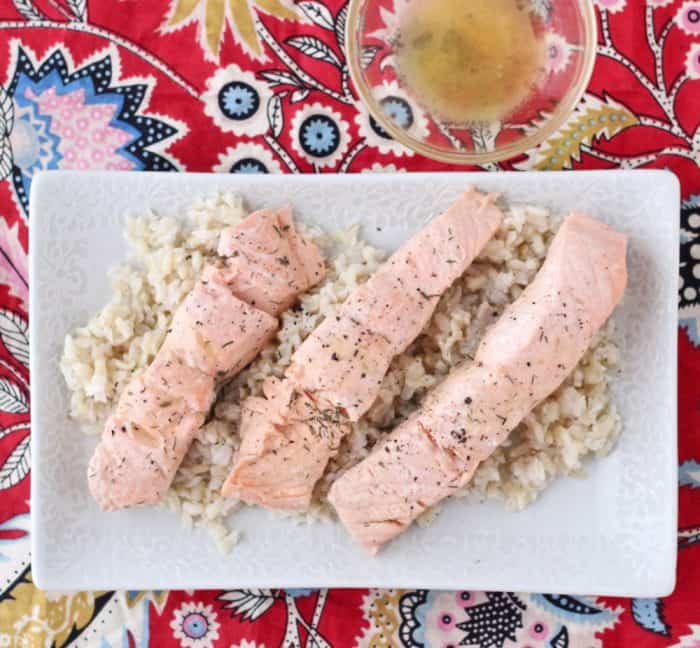 Lazy Girl's Champagne Poached Salmon proves that you don't have to get out of your pajamas just to have a fancy, delicious meal. Champagne Poached Salmon from Living Well Kitchen @memeinge