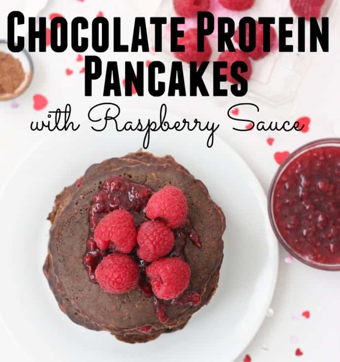 Chocolate Protein Pancakes with raspberries and raspberry sauce with writing on photo