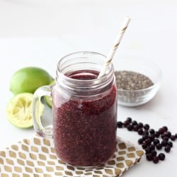 Wild Blueberry Limeade Smoothie in mason jar with straw, frozen wild blueberries, lime, chia seeds
