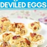 deviled eggs topped with bacon and cayenne pepper on a white plate