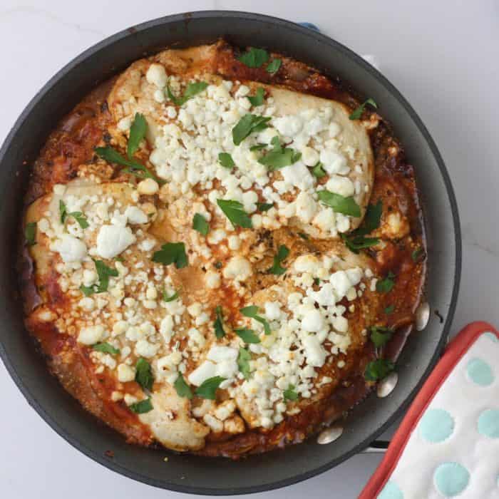 skillet with feta covered chicken 