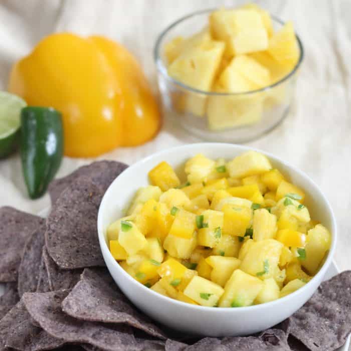 A sweet and spicy salsa served as a dip with blue corn chips for a festive football snack. Pineapple Salsa is a fresh and healthy way to add flavor to your day that's gluten free and vegan. This recipe is also delicious served over cooked fish or chicken as well as in tacos or over eggs. 