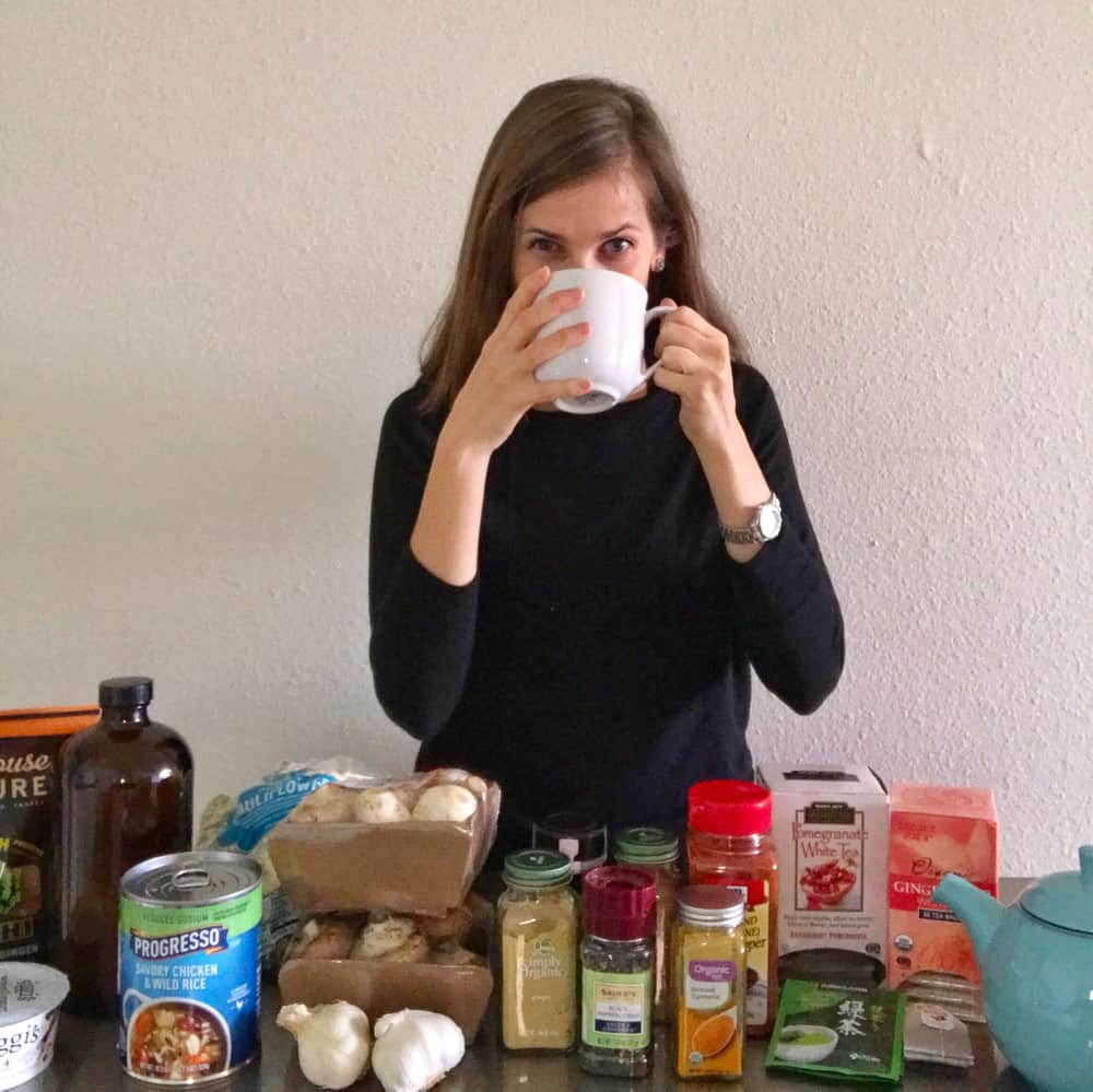 Meme drinking tea surrounded by immune supporting ingredients.