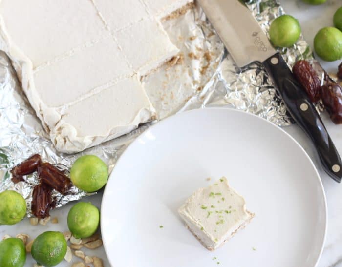 dates, key lime, cashews, Key Lime Pie Bars on foil with bar on plate