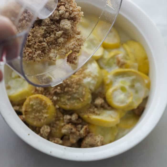 sprinkling bread crumbs over squash casserole