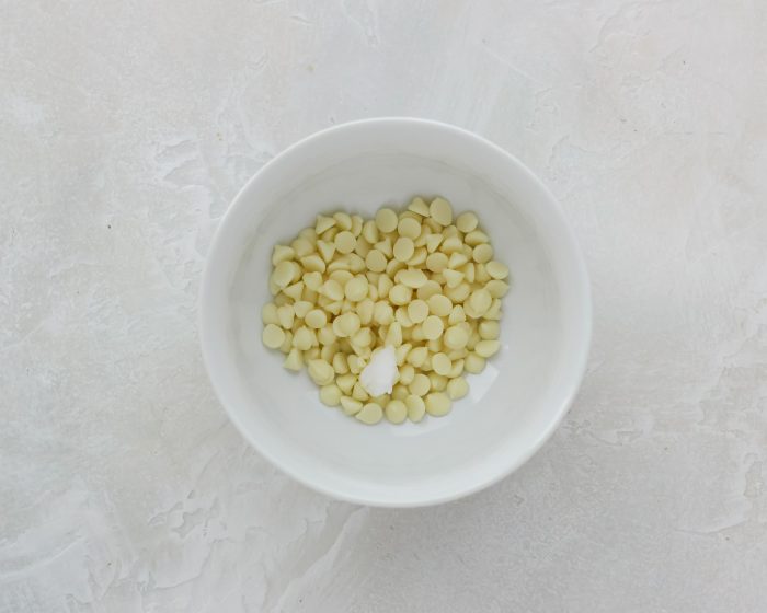 bowl of white chocolate chips and coconut oil
