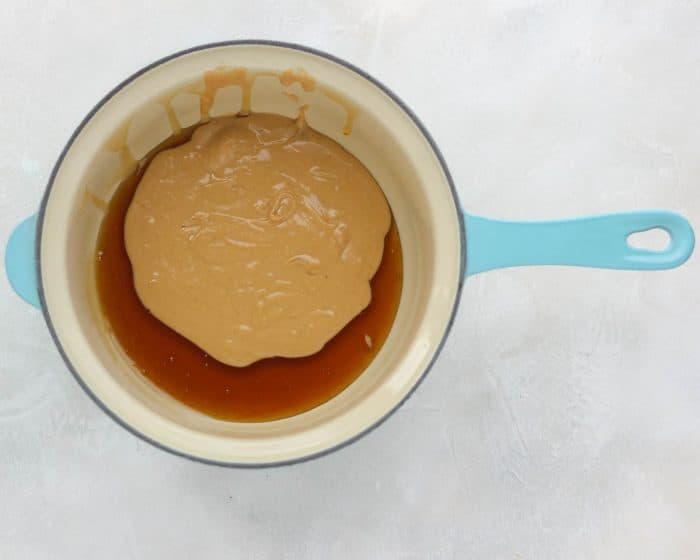 honey and cashew butter in blue saucepan