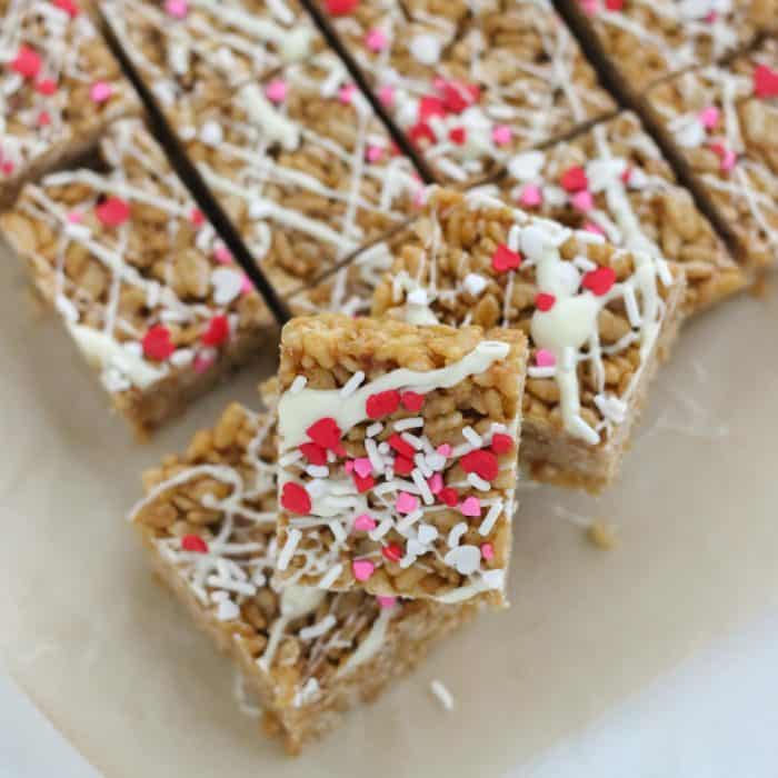 rice crispy treats with white chocolate and Valentine's Day heart sprinkles
