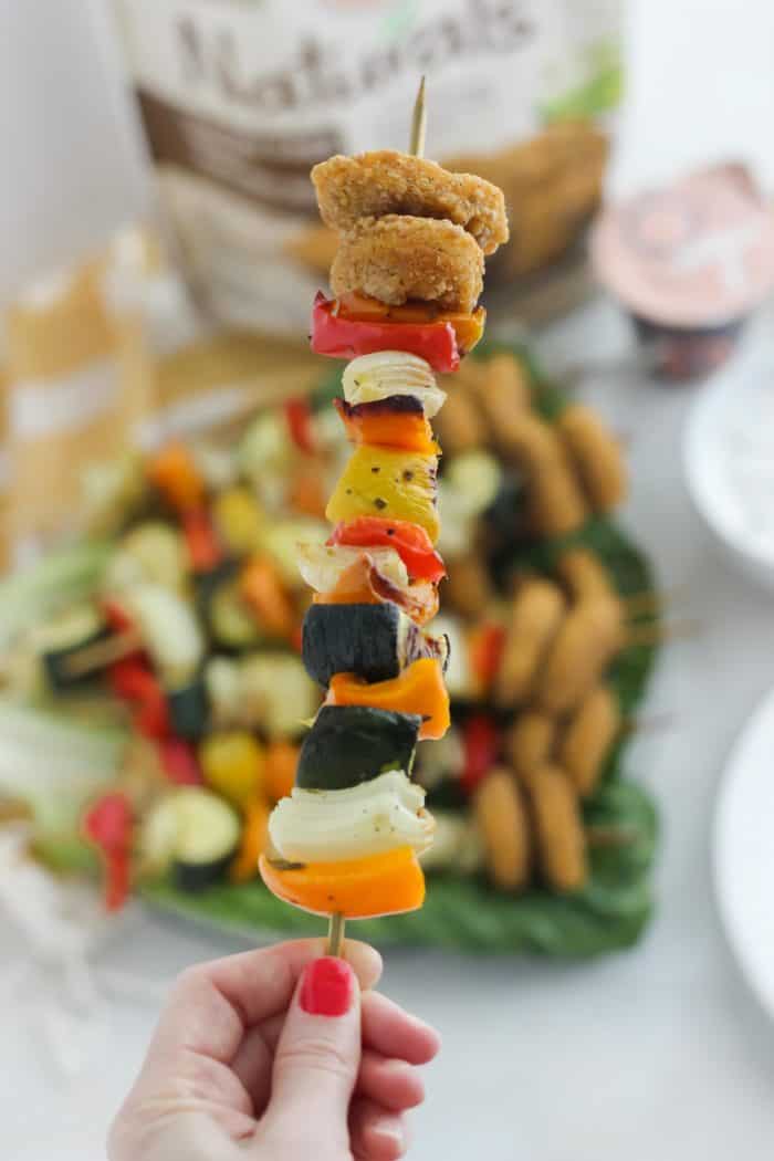 vegetable kabob with chicken nuggets and a plate of kabobs