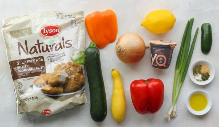 frozen chicken nuggets, orange bell pepper, zucchini, yellow squash, onion, red bell pepper, lemon, peach yogurt, green onions, spices, jalapeño, spices, olive oil