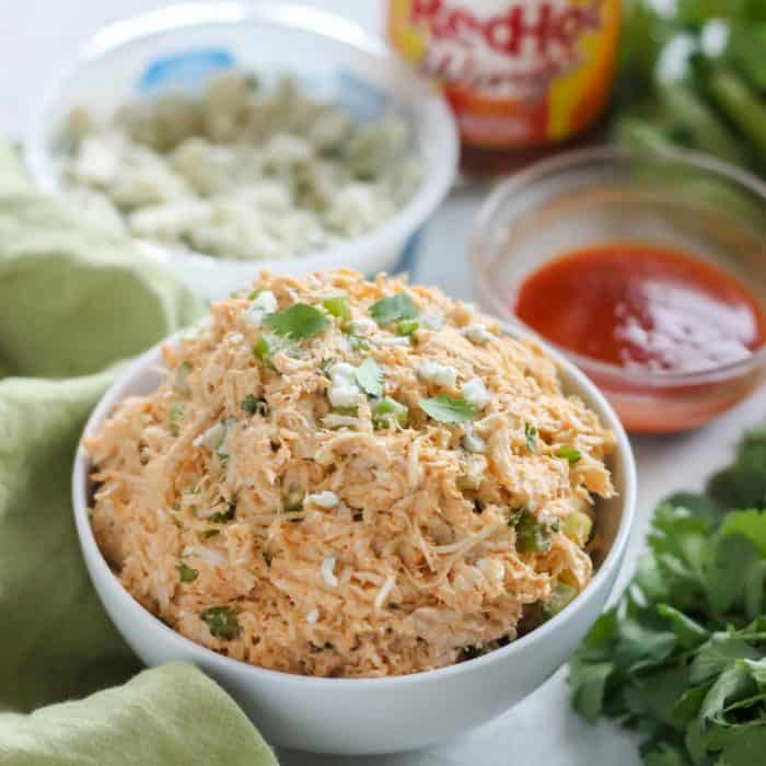 bowl of Buffalo Chicken Salad, blue cheese, wing sauce, celery, cilantro