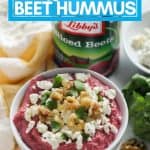 bowl of beet hummus with walnuts, feta, cilantro and sliced canned beets with photo description