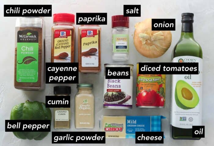 chili powder, bell pepper, cayenne pepper, paprika, cumin, garlic powder, salt, onion, black beans, diced tomatoes, cheese, oil