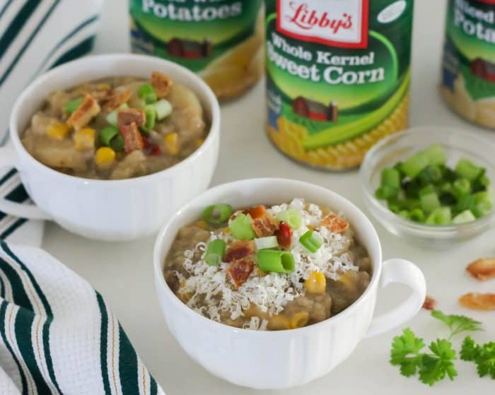 cheeseburger chowder in two white cups with green white striped towel and canned corn and potatoes