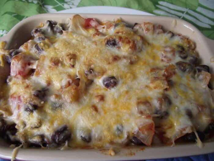 casserole dish with beans covered in cheese