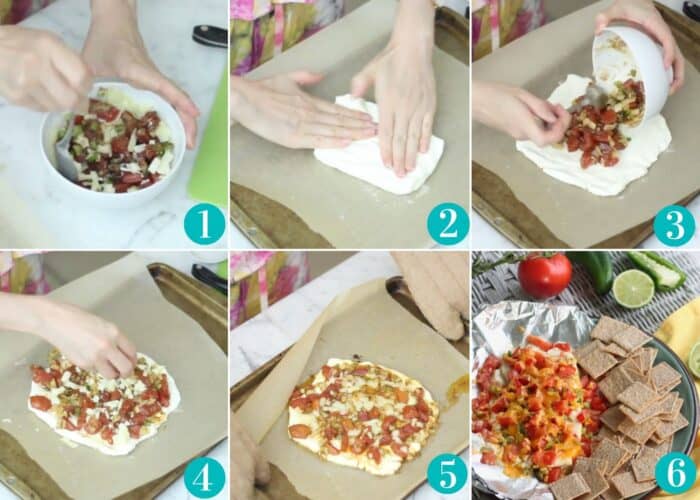 hands stirring together tomatoes, spices and cheese then pressing cream cheese onto parchment lined cream cheese; topping cream cheese with tomato mixture; sprinkling with cheese; remove from oven and serve with crackers