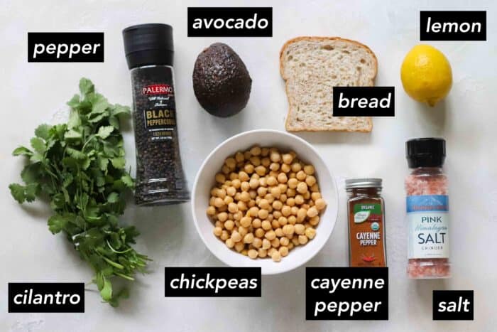 cilantro, pepper, avocado, bread, lemon, salt, cayenne pepper, chickpeas with black text overlay on photo