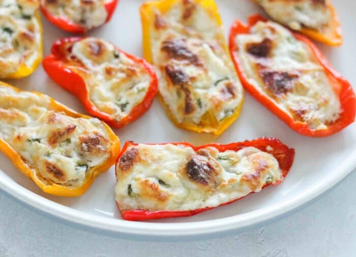 close view of baby bell peppers stuffed with cream cheese