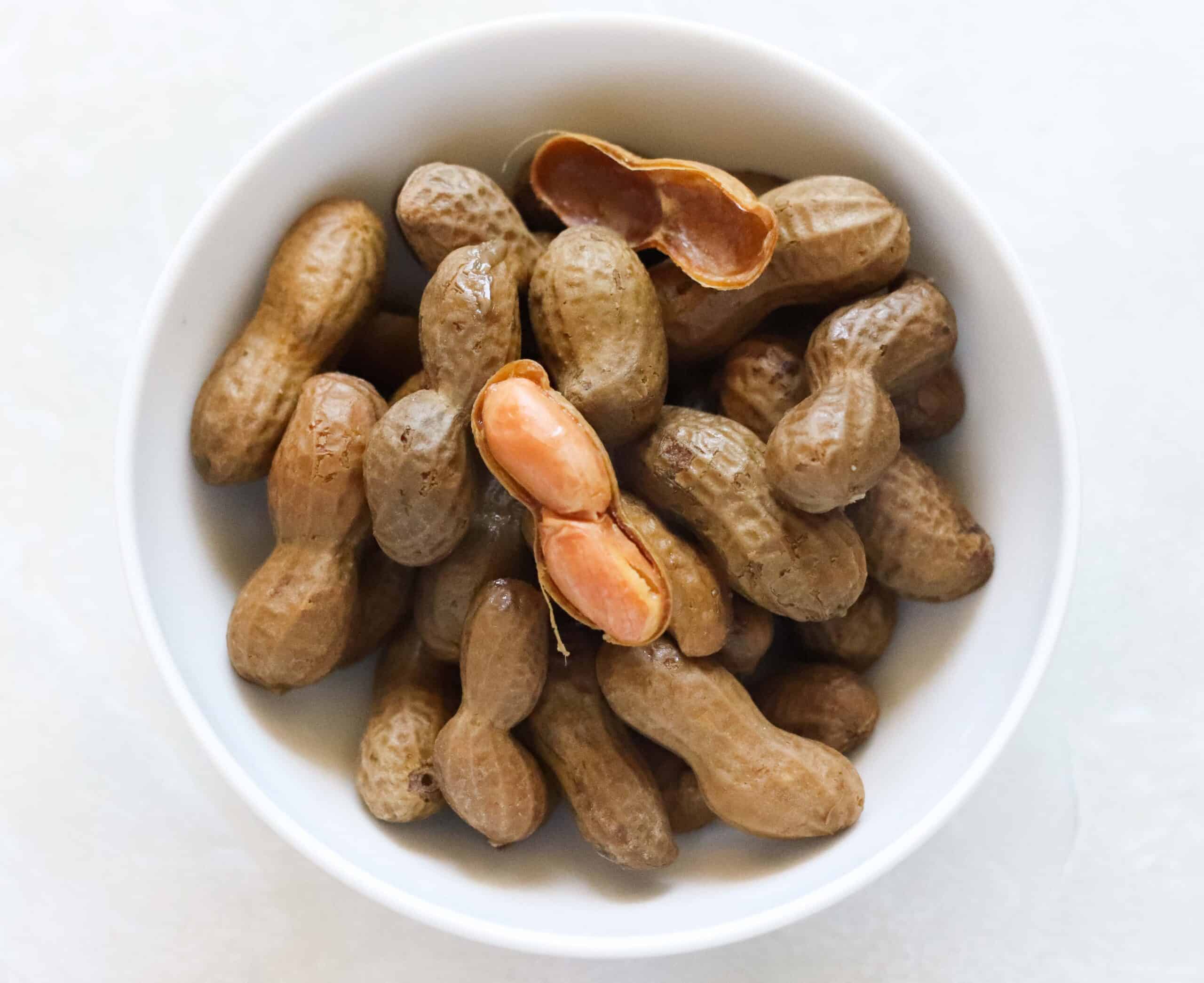 white bowl of boiled peanuts