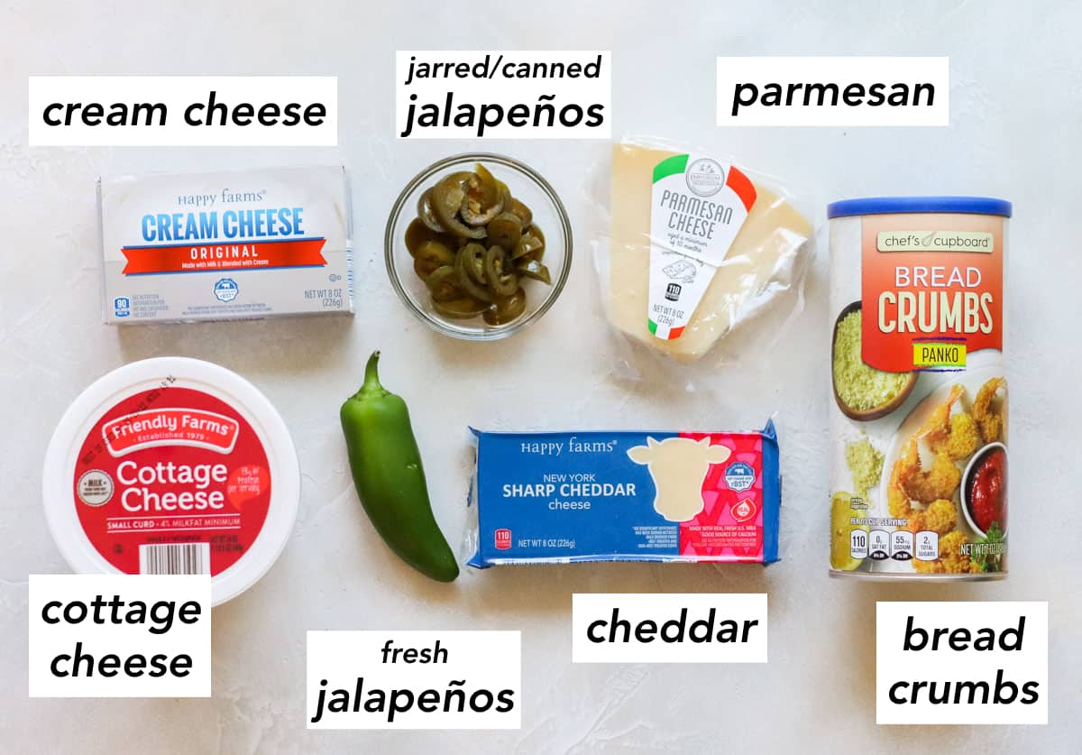 block of cream cheese, container of cottage cheese, fresh jalapeno, bowl of pickled sliced jalapenos, block of sharp cheddar cheese, wedge of parmesan cheese, container of panko bread crumbs