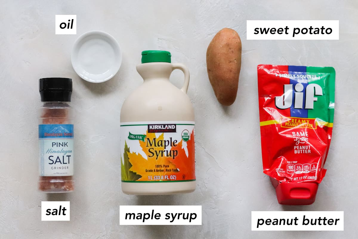 salt grinder, small bowl of oil, bottle of maple syrup, sweet potato, package of peanut butter