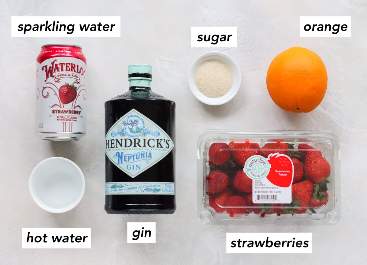 can of strawberry sparkling water, bowl of hot water, bottle of gin, container of strawberries, small bowl of sugar, fresh orange