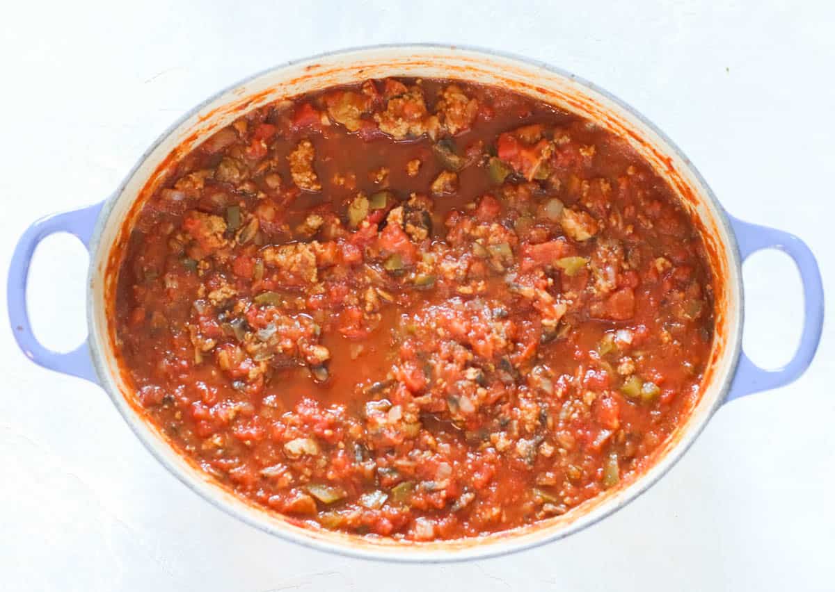cooked turkey meat sauce for spaghetti in a blue pot
