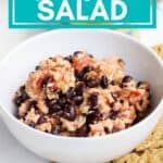 tuna salad in a white bowl surrounded by crackers with text that reads easy, budget-friendly, no mayo tuna salsa salad.