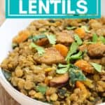 bowl of sausage and lentils on wooden table with text overlay that reads family favorite, budget friendly, gluten free sausage and lentils.
